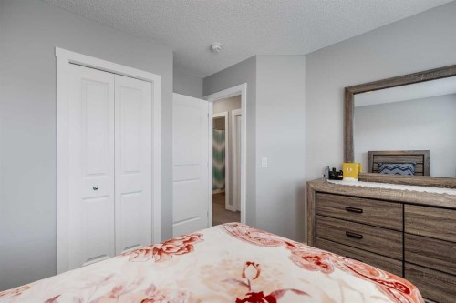 114 Hillcrest Close Sw, Airdrie, AB - Indoor Photo Showing Bedroom