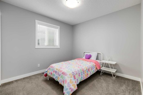 114 Hillcrest Close Sw, Airdrie, AB - Indoor Photo Showing Bedroom