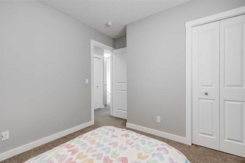 114 Hillcrest Close Sw, Airdrie, AB - Indoor Photo Showing Bedroom