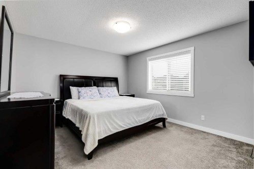 114 Hillcrest Close Sw, Airdrie, AB - Indoor Photo Showing Bedroom
