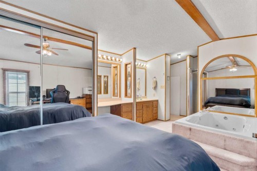 254 Erin Woods Circle Se, Calgary, AB - Indoor Photo Showing Bedroom