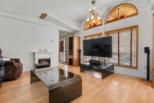 254 Erin Woods Circle Se, Calgary, AB - Indoor Photo Showing Living Room With Fireplace