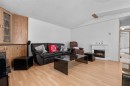 254 Erin Woods Circle Se, Calgary, AB  - Indoor Photo Showing Living Room With Fireplace 