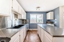 26 Green Meadow Drive, Strathmore, AB  - Indoor Photo Showing Kitchen With Double Sink 