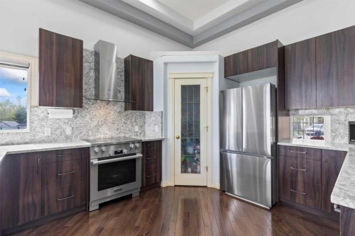 72 Strathlea Place Sw, Calgary, AB - Indoor Photo Showing Kitchen With Upgraded Kitchen