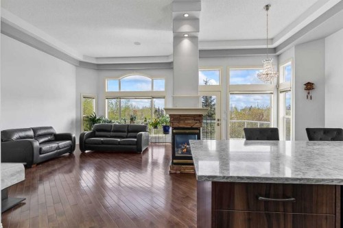 72 Strathlea Place Sw, Calgary, AB - Indoor Photo Showing Other Room With Fireplace