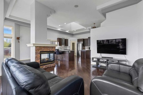 72 Strathlea Place Sw, Calgary, AB - Indoor Photo Showing Living Room With Fireplace