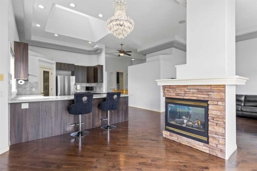 72 Strathlea Place Sw, Calgary, AB - Indoor With Fireplace