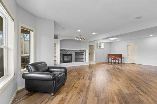 72 Strathlea Place Sw, Calgary, AB - Indoor Photo Showing Living Room With Fireplace