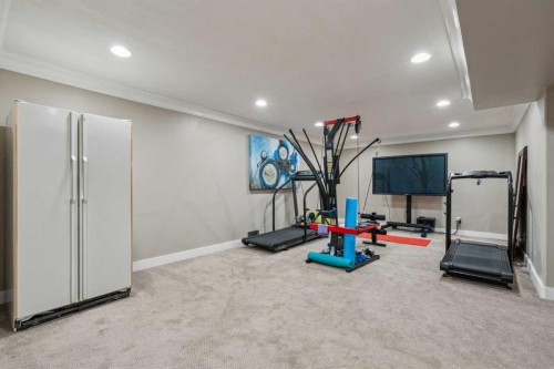 25 Manor Road Sw, Calgary, AB - Indoor Photo Showing Gym Room