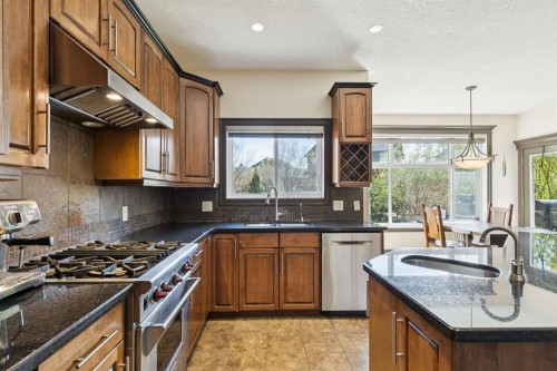 957 Coopers Drive Sw, Airdrie, AB - Indoor Photo Showing Kitchen With Upgraded Kitchen