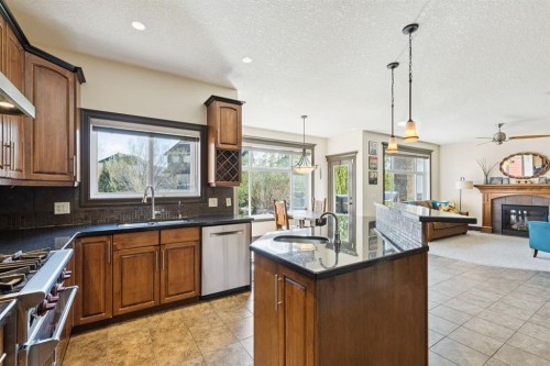957 Coopers Drive Sw, Airdrie, AB - Indoor Photo Showing Kitchen With Upgraded Kitchen
