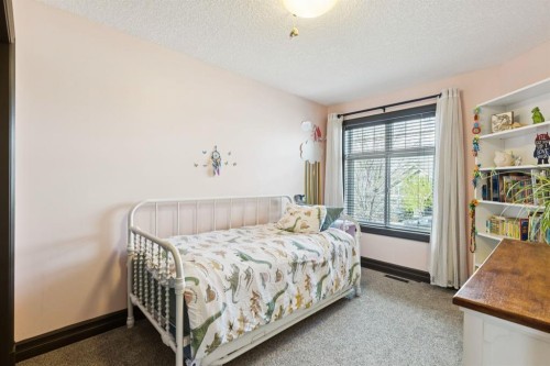 957 Coopers Drive Sw, Airdrie, AB - Indoor Photo Showing Bedroom