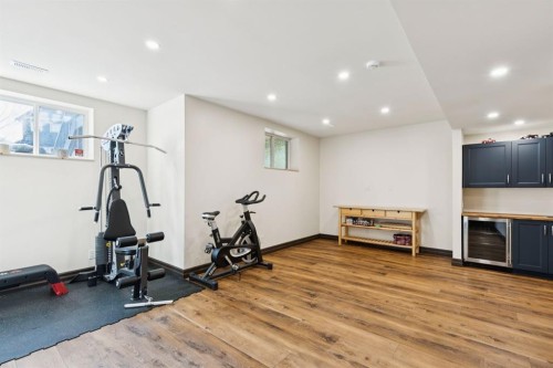 957 Coopers Drive Sw, Airdrie, AB - Indoor Photo Showing Gym Room