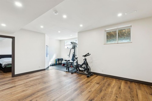 957 Coopers Drive Sw, Airdrie, AB - Indoor Photo Showing Gym Room