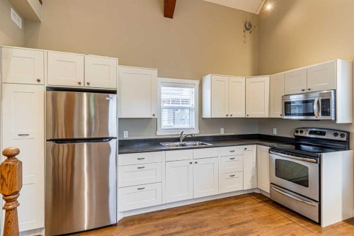 201 Cottageclub Crescent, Rural Rocky View County, AB - Indoor Photo Showing Kitchen With Stainless Steel Kitchen With Double Sink