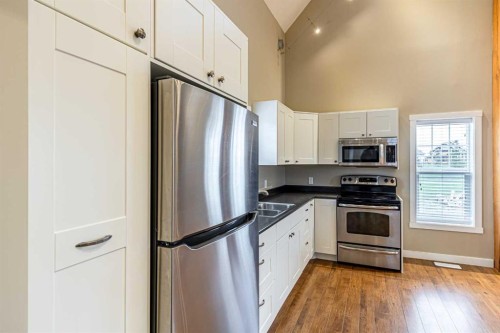 201 Cottageclub Crescent, Rural Rocky View County, AB - Indoor Photo Showing Kitchen With Stainless Steel Kitchen