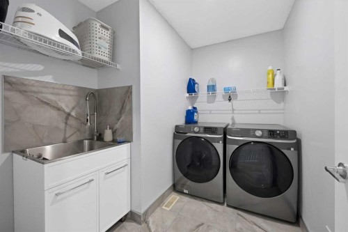 218 Saddlefield Place Ne, Calgary, AB - Indoor Photo Showing Laundry Room