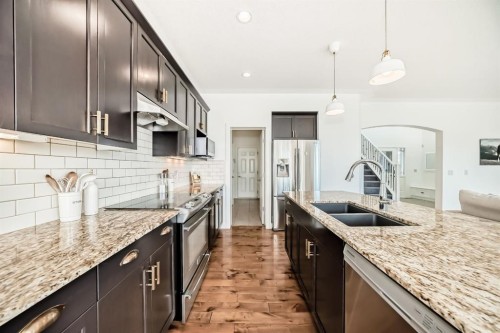 35 Sunset View, Cochrane, AB - Indoor Photo Showing Kitchen With Stainless Steel Kitchen With Double Sink With Upgraded Kitchen