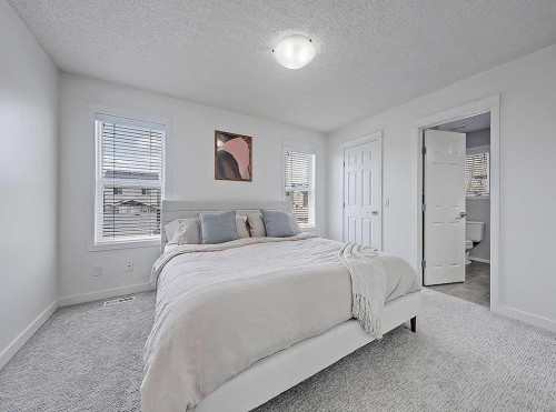 558 Evermeadow Road Sw, Calgary, AB - Indoor Photo Showing Bedroom