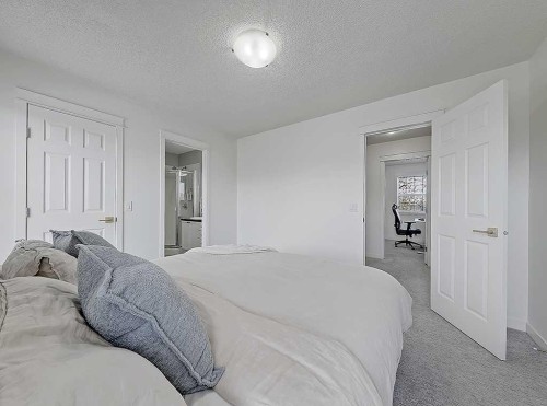 558 Evermeadow Road Sw, Calgary, AB - Indoor Photo Showing Bedroom