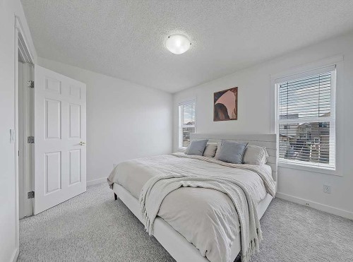 558 Evermeadow Road Sw, Calgary, AB - Indoor Photo Showing Bedroom