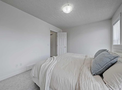 558 Evermeadow Road Sw, Calgary, AB - Indoor Photo Showing Bedroom
