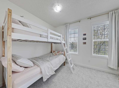 558 Evermeadow Road Sw, Calgary, AB - Indoor Photo Showing Bedroom