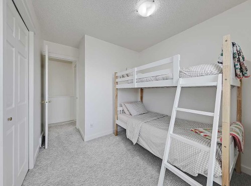 558 Evermeadow Road Sw, Calgary, AB - Indoor Photo Showing Bedroom