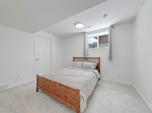 558 Evermeadow Road Sw, Calgary, AB - Indoor Photo Showing Bedroom