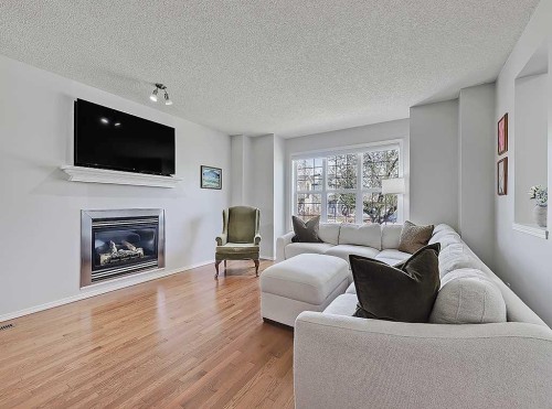 558 Evermeadow Road Sw, Calgary, AB - Indoor Photo Showing Living Room With Fireplace