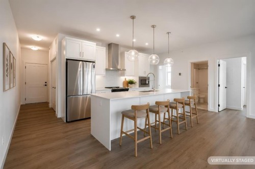 4403-200 Seton Circle Se, Calgary, AB - Indoor Photo Showing Kitchen With Stainless Steel Kitchen With Upgraded Kitchen