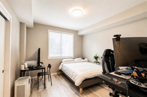 102-130 Redstone Ne, Calgary, AB - Indoor Photo Showing Bedroom