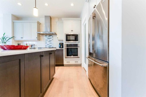 42 Buckskin Way, Cochrane, AB - Indoor Photo Showing Kitchen With Stainless Steel Kitchen