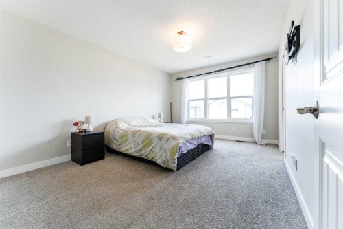 42 Buckskin Way, Cochrane, AB - Indoor Photo Showing Bedroom