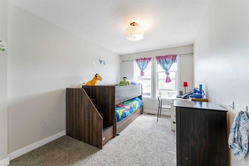 42 Buckskin Way, Cochrane, AB - Indoor Photo Showing Bedroom