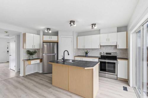 30 Tuscany Springs Heights Nw, Calgary, AB - Indoor Photo Showing Kitchen With Double Sink