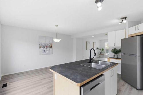 30 Tuscany Springs Heights Nw, Calgary, AB - Indoor Photo Showing Kitchen With Double Sink