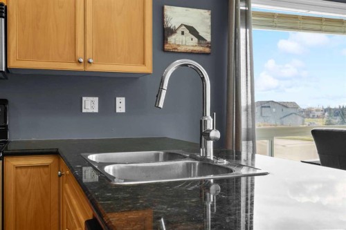 302 Sunrise Terrace Ne, High River, AB - Indoor Photo Showing Kitchen With Double Sink