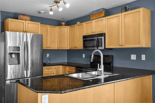 302 Sunrise Terrace Ne, High River, AB - Indoor Photo Showing Kitchen With Stainless Steel Kitchen With Double Sink