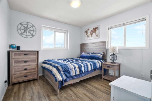 302 Sunrise Terrace Ne, High River, AB - Indoor Photo Showing Bedroom