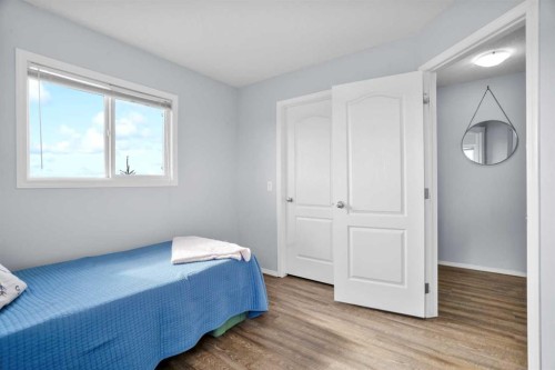 302 Sunrise Terrace Ne, High River, AB - Indoor Photo Showing Bedroom