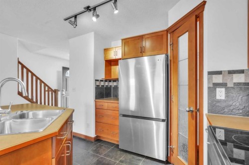 141 Cramond Close Se, Calgary, AB - Indoor Photo Showing Kitchen With Double Sink