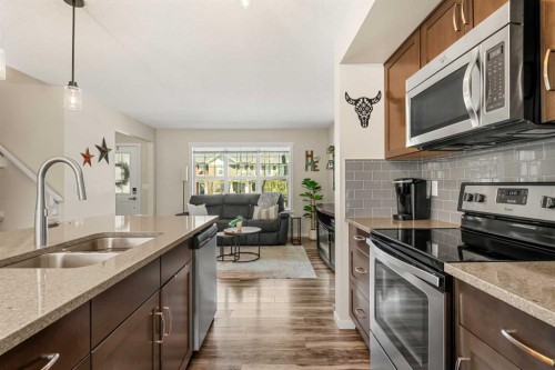 40 Sunvalley Road, Cochrane, AB - Indoor Photo Showing Kitchen With Stainless Steel Kitchen With Double Sink With Upgraded Kitchen