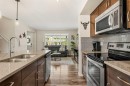 40 Sunvalley Road, Cochrane, AB  - Indoor Photo Showing Kitchen With Stainless Steel Kitchen With Double Sink With Upgraded Kitchen 
