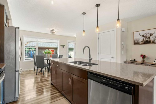 40 Sunvalley Road, Cochrane, AB - Indoor Photo Showing Kitchen With Double Sink With Upgraded Kitchen