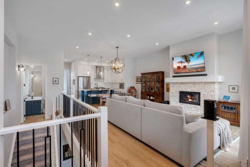 541 Marine Drive Se, Calgary, AB - Indoor Photo Showing Living Room With Fireplace