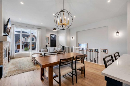 541 Marine Drive Se, Calgary, AB - Indoor Photo Showing Dining Room With Fireplace