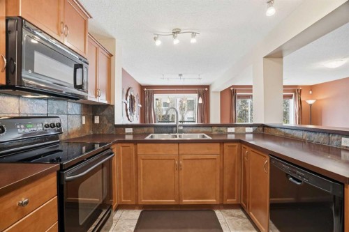 56 Everglen Way Sw, Calgary, AB - Indoor Photo Showing Kitchen With Double Sink