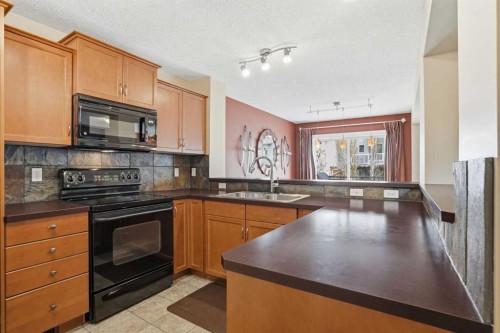 56 Everglen Way Sw, Calgary, AB - Indoor Photo Showing Kitchen With Double Sink